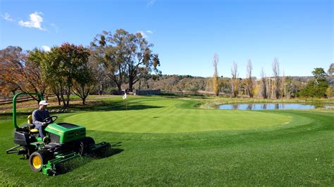 mowing a golf course with skid steer|Skid.